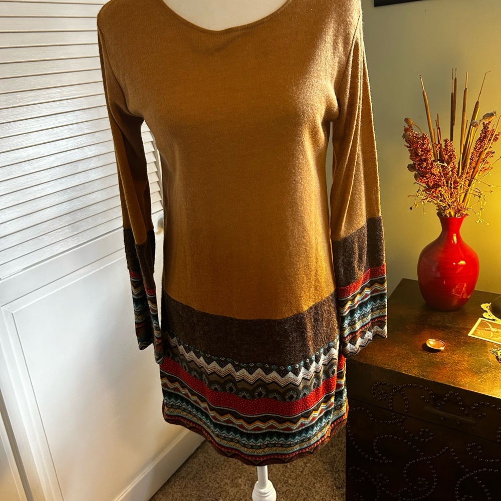 Yak & Yeti sweater tunic is gold.